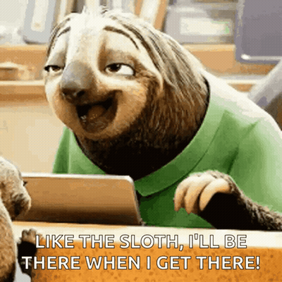 Cartoon Sloth Sitting At Table With Tablet Saying I'll Be There GIF
