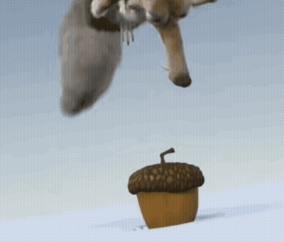 Cartoon Squirrel Standing On Acorn In Snow GIF