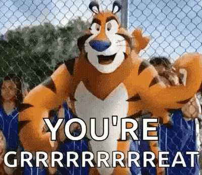 Cartoon Tiger Standing In Front Of Chain Link Fence GIF