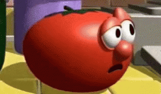 Cartoon Tomato With Big Nose On Table GIF