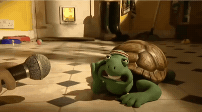 Cartoon Turtle Lying With Microphone GIF