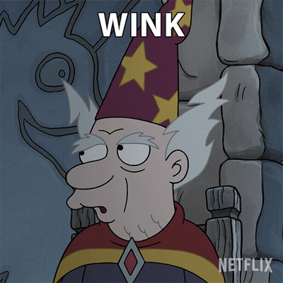 Cartoon Wizard Saying Wink GIF