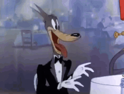 Cartoon Wolf In Tuxedo And White Gloves Making Funny Face GIF