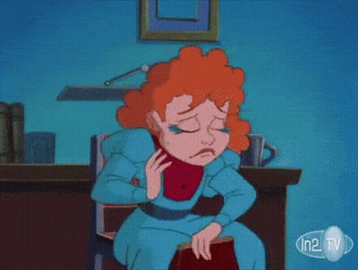 Cartoon Woman Sitting At Desk With In2 TV GIF