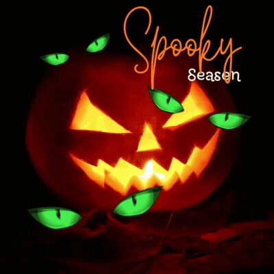 Carved Halloween Pumpkin With Green Eyes Spooky Season GIF