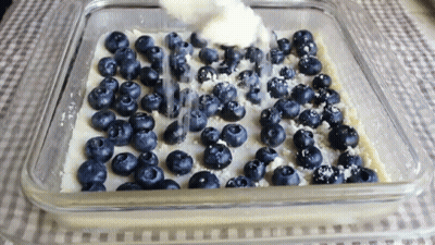 Casserole Dish With Blueberries And Whipped Cream GIF