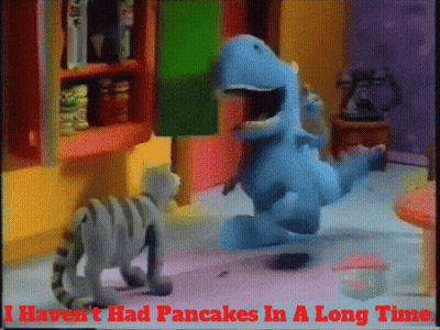 Cat And Dinosaur Saying I Haven't Had Pancakes In A Long Time GIF