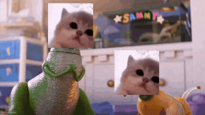 Cat Beside Toy Lizard And Toy Dog GIF