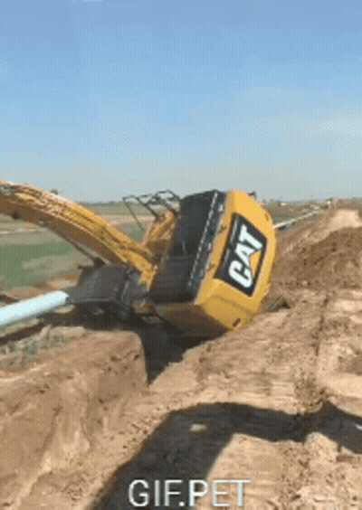 Cat Excavator Stuck In Dirt GIF