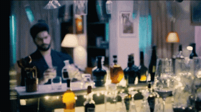 Cat In Hat And Bow Tie Pointing At Camera GIF