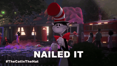 Cat In Red And White Hat Says Nailed It In Front Of Fire Truck GIF