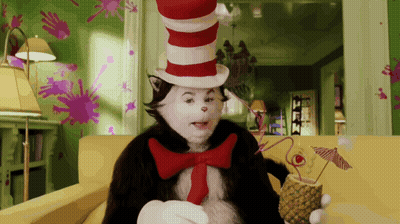 Cat In The Hat Holding Pineapple Cocktail GIF