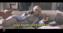 Cat Lady Lying On Couch With Pet GIF