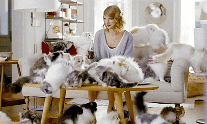 Cat Lady Taylor Swift Sitting On Couch GIF