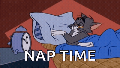 Cat Laying In Bed Next To Alarm Clock Saying Nap Time GIF