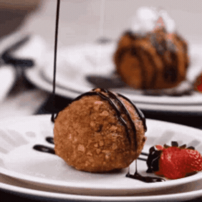 Cat Shaped Pudding With Whipped Cream And Cherry GIF