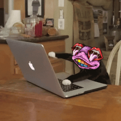 Cat Sitting At Apple Laptop With Cartoon Face GIF