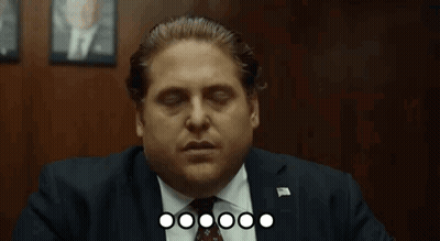 Cat Sitting On Couch Next To Bowl Of Popcorn GIF
