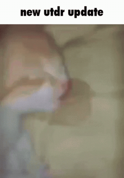 Cat Sleeping On Bed Saying New Utdr Update GIF