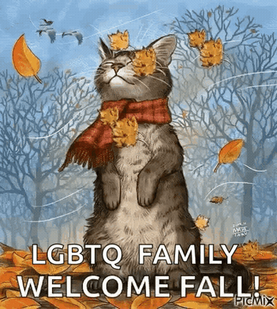 Cat Wearing Scarf With Leaves In Woods GIF