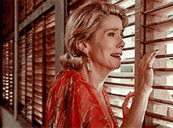 Catherine Deneuve Looking Out The Window GIF