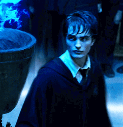 Cedric Diggory Touching Blue Fire GIF