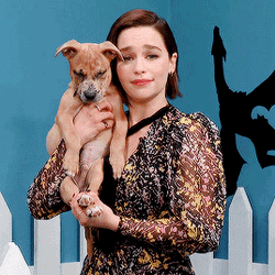 Celebrity Emilia Clarke Carrying Cute Dog GIF