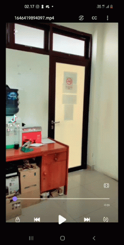 Cell Phone Showing Room With No Smoking Sign GIF
