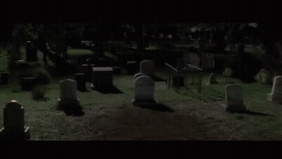 Cemetery With Graves And Fence At Night GIF