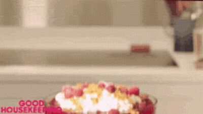 Cereal Bowl With Raspberries And Whipped Cream Good Housekeeping GIF