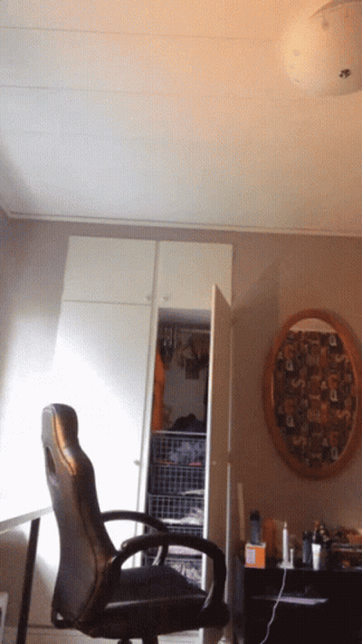 Chair In Front Of Closet With Picture Saying A GIF