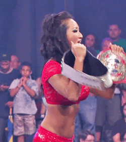 Champ Is Here Gail Kim Showing Two Belts GIF