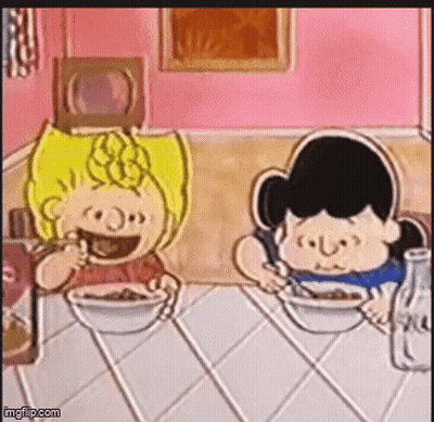 Charlie Brown And Lucy Brown Are Sitting At A Table With Bowls Of Cereal GIF