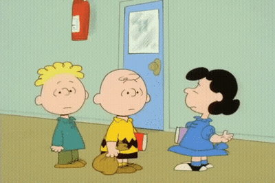 Charlie Brown And Lucy Brown Are Standing Next To Each Other In A Hallway GIF