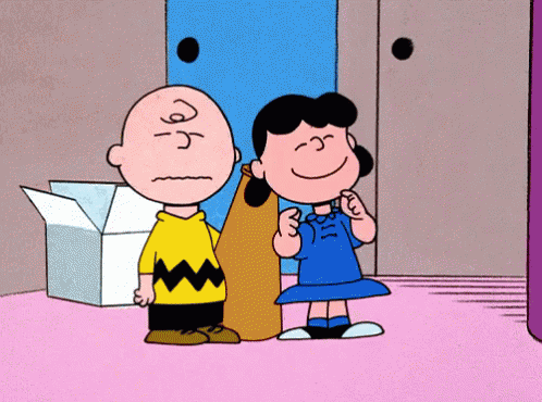Charlie Brown And Lucy Brown Are Standing Next To Each Other In A Room GIF
