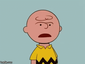 Charlie Brown And Lucy Brown From The Peanuts Cartoon Are Standing In A Field Of Leaves . GIF