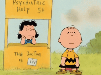 Charlie Brown And Lucy Brown Stand In Front Of A Psychiatric Help Booth GIF