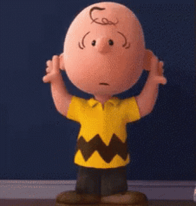 Charlie Brown From The Peanuts Movie Is Standing In Front Of A Blue Wall With His Hands Outstretched . GIF