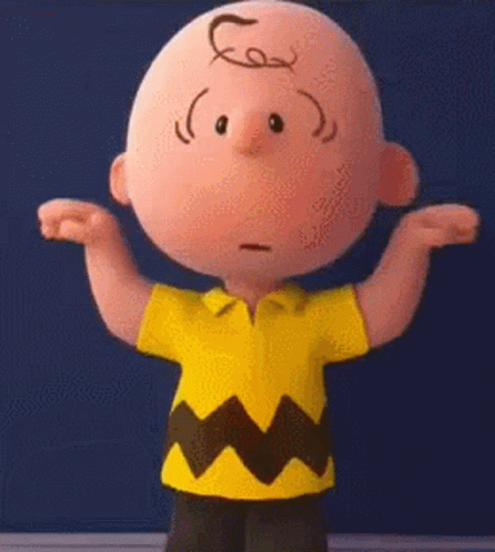 Charlie Brown From The Peanuts Movie Is Standing With His Arms Outstretched And Looking At The Camera . GIF