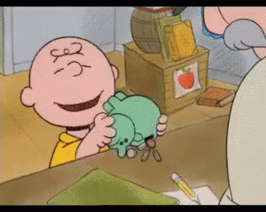 Charlie Brown Holding Stuffed Animal Number 3 GIF