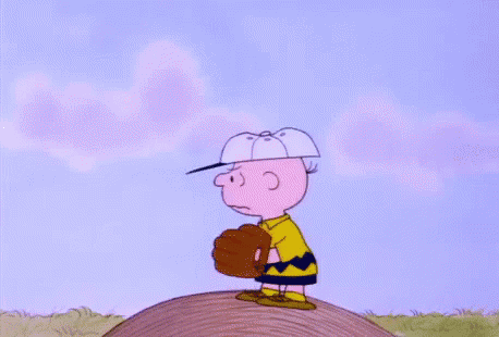 Charlie Brown Is Doing A Handstand In The Air While Wearing Socks And Shoes . GIF