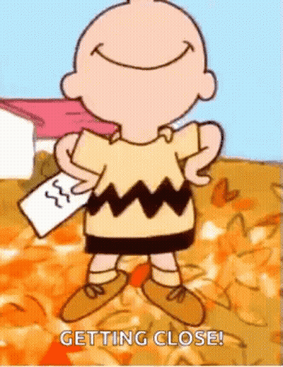 Charlie Brown Smiling Holding Paper GIF
