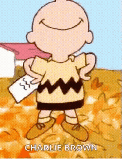 Charlie Brown Smiling Holding Paper