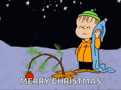 Charlie Brown Standing Next To Christmas Tree GIF