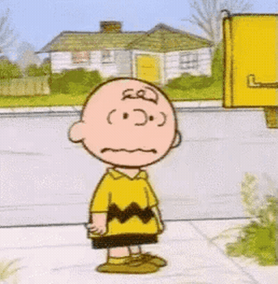 Charlie Brown Standing On Sidewalk With Mouth Open Saying Good Grief GIF