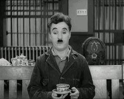 Charlie Chaplin Drinking Coffee