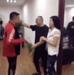 Cheating Wife Behind Her Husband GIF