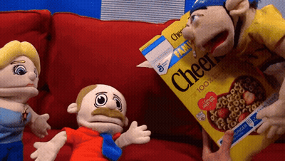 Cheerios Box On Red Couch With Stuffed Animals GIF