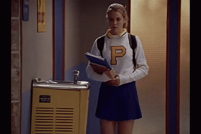 Cheerleader Girl Holding Notebook By Fountain GIF