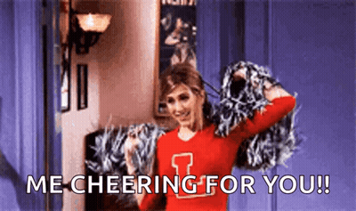 Cheerleader Holding Pom Poms Saying Me Cheering For You GIF